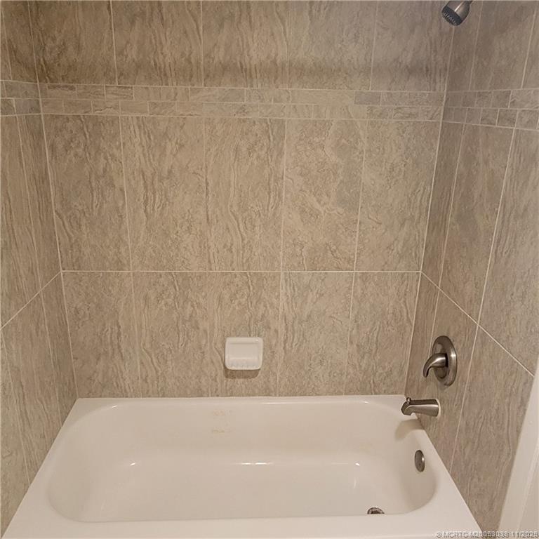 1526 Southeast Royal Green Circle, Unit 205 Port St. Lucie, FL 34952 - Photo 28 of 34 a bathroom with a bathtub