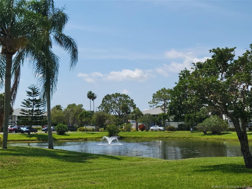 1526 Southeast Royal Green Circle, Unit 205 Port St. Lucie, FL 34952 - Photo 33 of 34 a view of swimming pool and lake view
