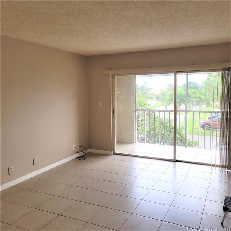 1526 Southeast Royal Green Circle, Unit 205 Port St. Lucie, FL 34952 - Photo 10 of 34 a view of an empty room and window