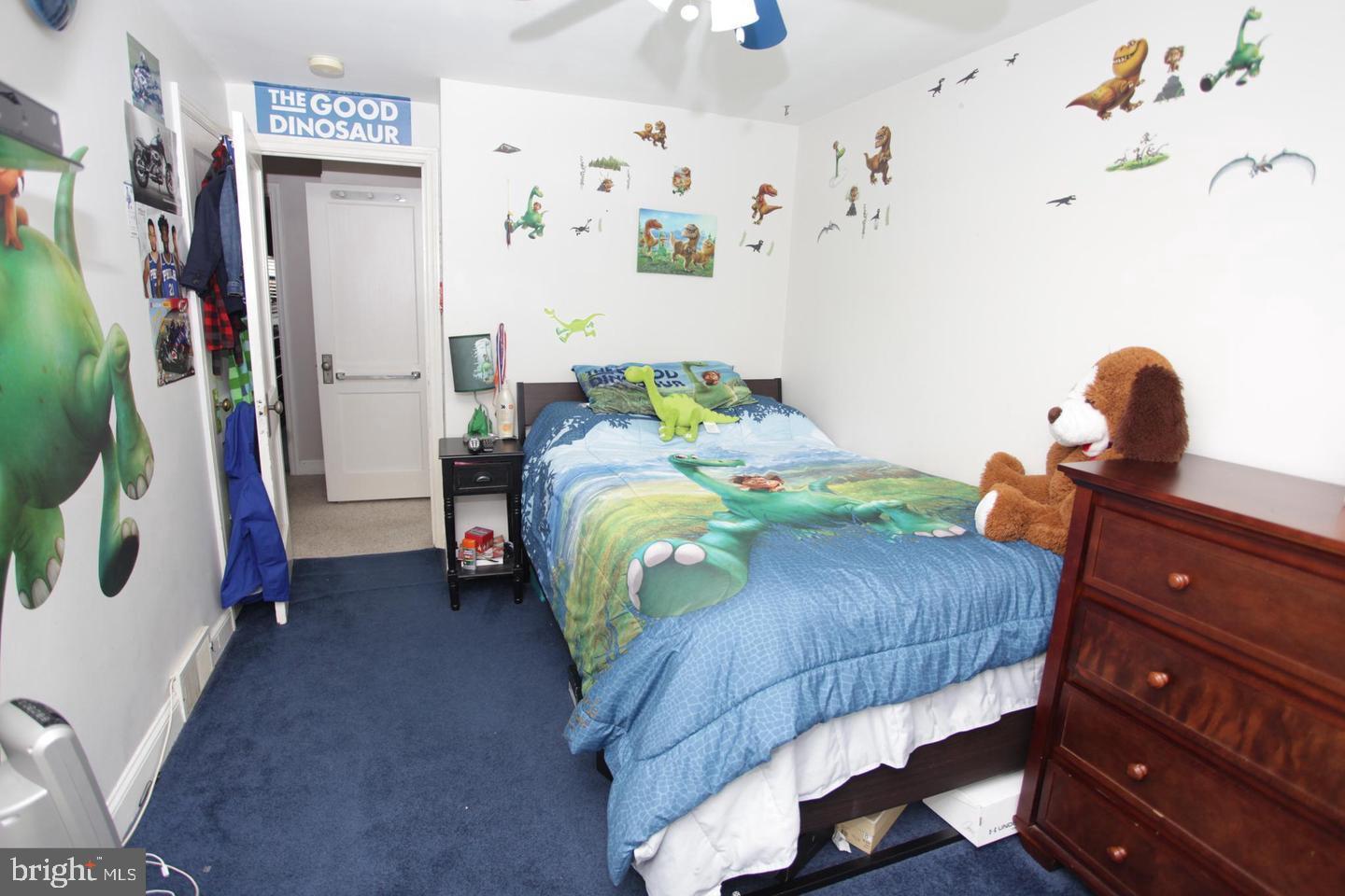 414 Rively Avenue Collingdale, PA 19023 - Photo 17 of 27 a bedroom with bed and a painting on the wall