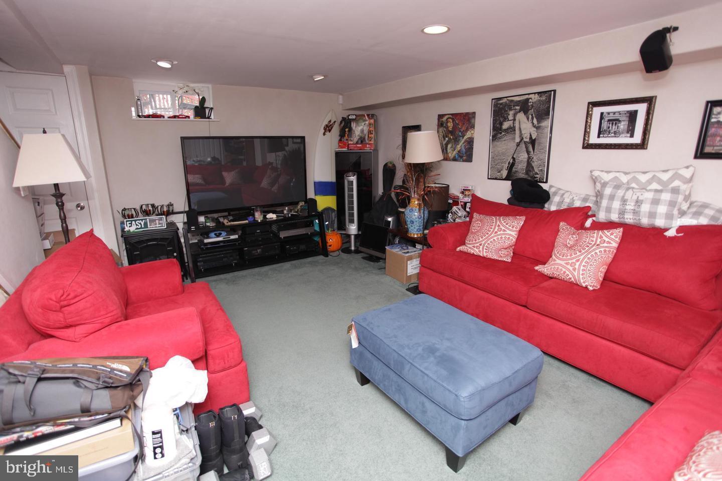 414 Rively Avenue Collingdale, PA 19023 - Photo 23 of 27 a living room with furniture and a flat screen tv