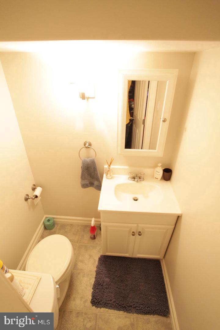 414 Rively Avenue Collingdale, PA 19023 - Photo 25 of 27 a bathroom with a sink and a mirror