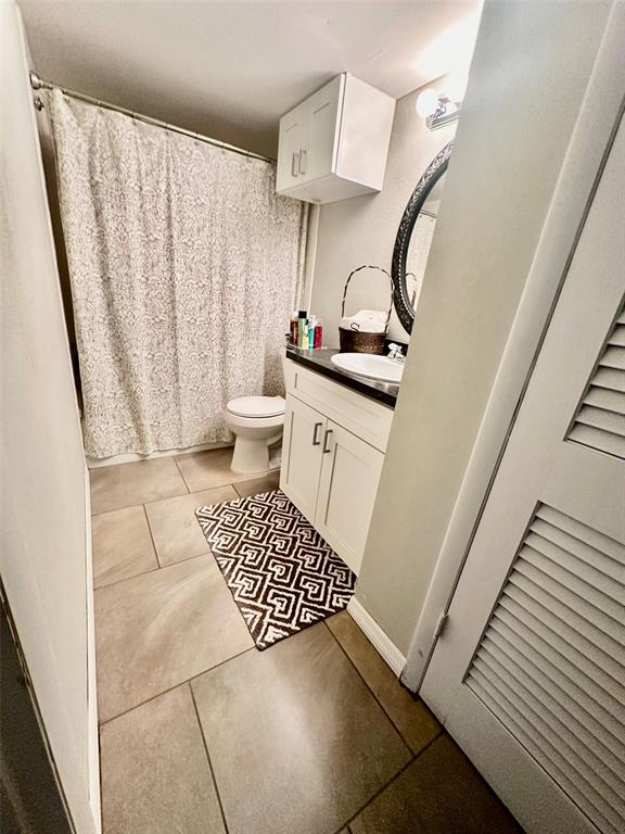 5207 Turquoise Lane, Unit 202 New Port Richey, FL 34652 - Photo 14 of 26 a bathroom with a sink and a mirror