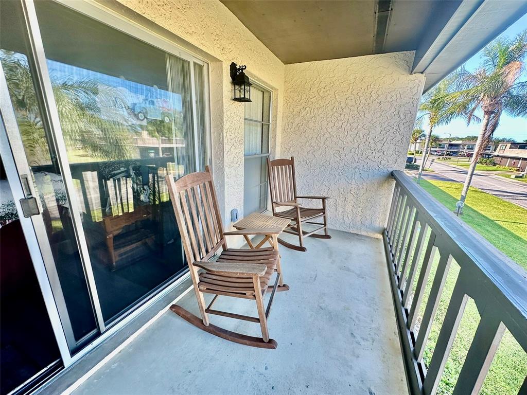 5207 Turquoise Lane, Unit 202 New Port Richey, FL 34652 - Photo 16 of 26 a view of living room with furniture and balcony