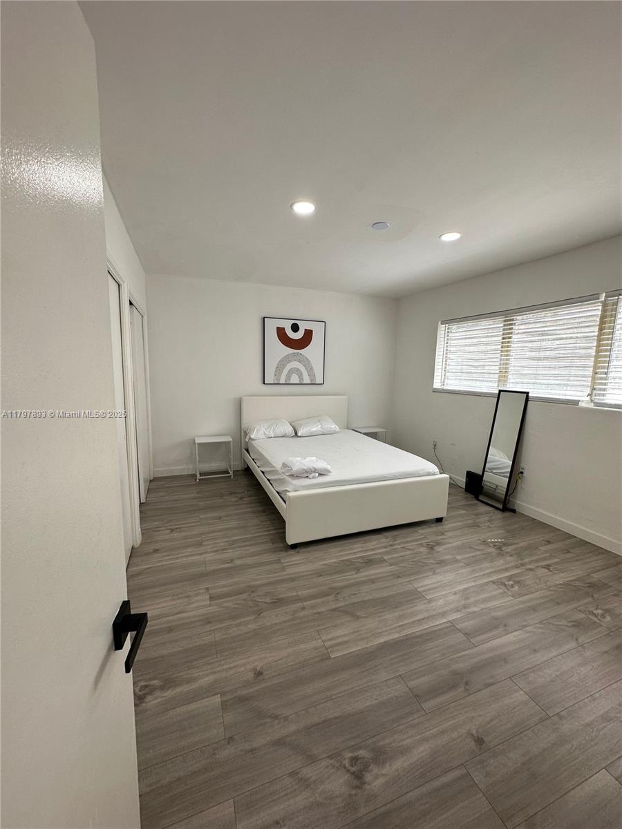 Surfside Surfside, FL 33154 - Photo 8 of 10 a bedroom with a bed and a dresser