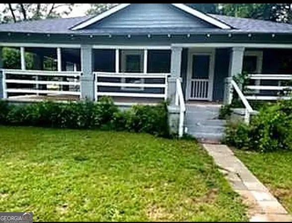 a house view with a garden space