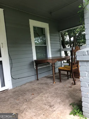a view of a two chairs in the patio