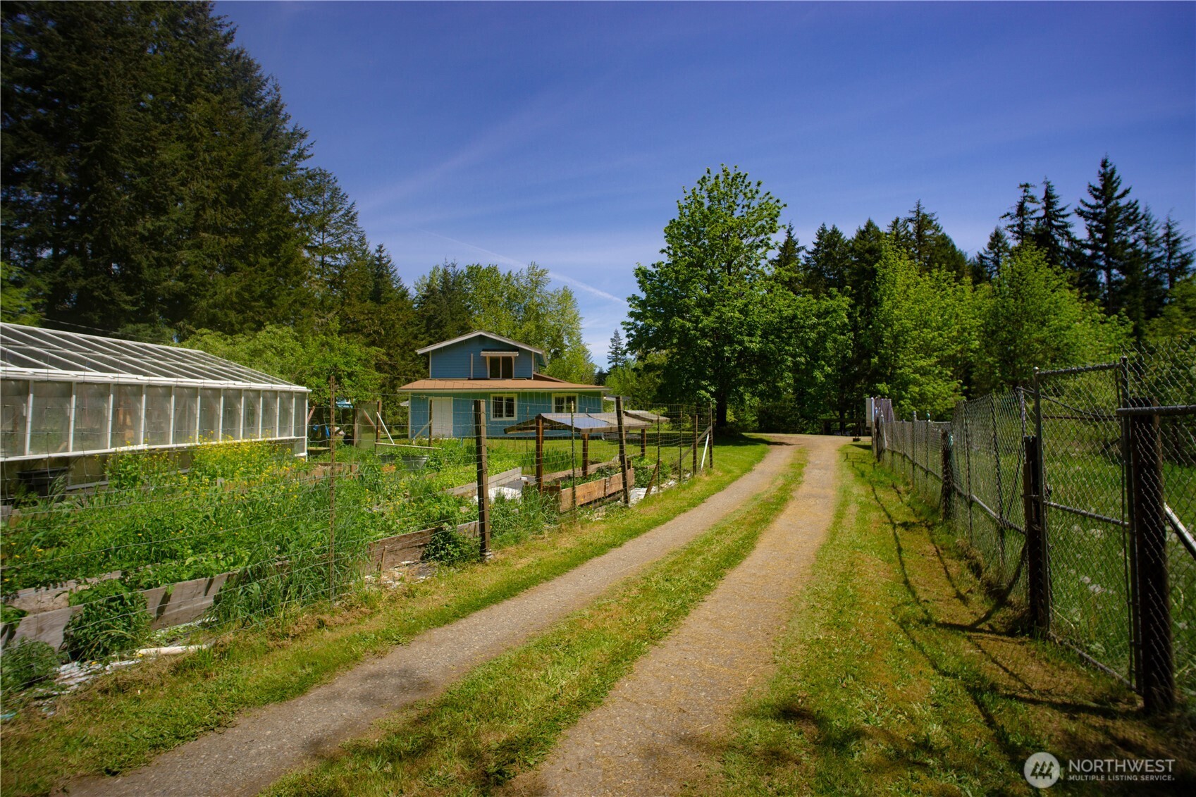 89 Slab Camp Road Sequim, WA 98382 - Photo 7 of 40 a view of a house with swimming pool and sitting area