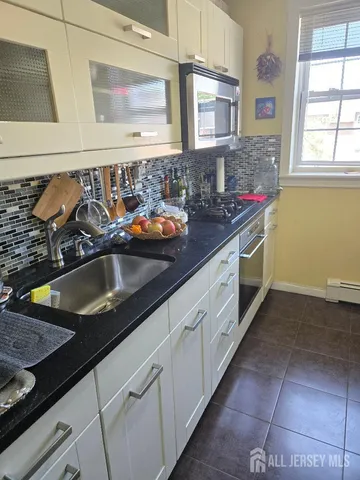 a view of a swimming pool with a yard