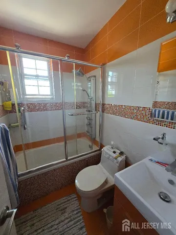 a bedroom with bed and window