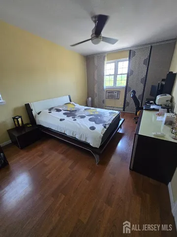 a view of a livingroom with furniture and an empty room