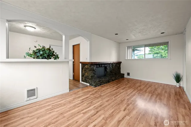 a view of a livingroom with wooden floor