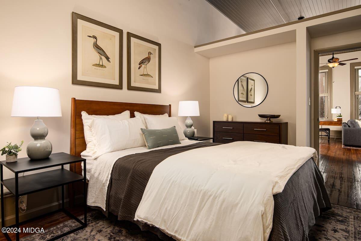 617 Cherry Street, Unit C Macon, GA 31201 - Photo 3 of 10 a bedroom with bed and painting on the wall