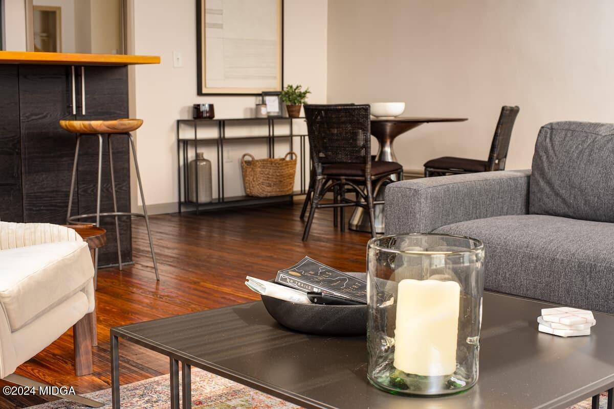 617 Cherry Street, Unit C Macon, GA 31201 - Photo 7 of 10 a living room with furniture and wooden floor