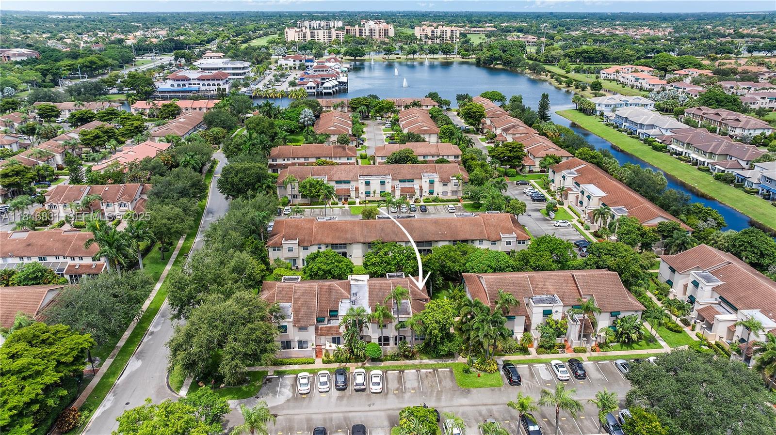 6603 Via Regina, Unit 50 Boca Raton, FL 33433 - Photo 1 of 48 an aerial view of a city with lots of residential buildings ocean and mountain view in back
