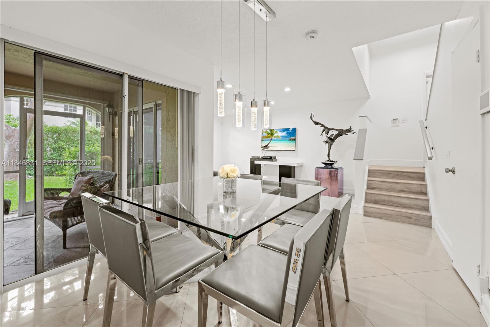 6603 Via Regina, Unit 50 Boca Raton, FL 33433 - Photo 14 of 48 a view of a dining room with furniture window and outside view