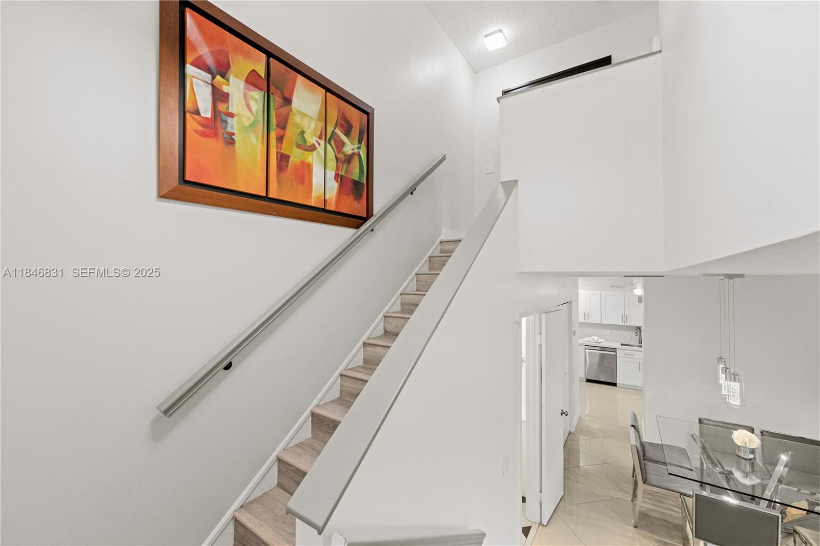 6603 Via Regina, Unit 50 Boca Raton, FL 33433 - Photo 22 of 48 a view of entryway and hall with wooden floor