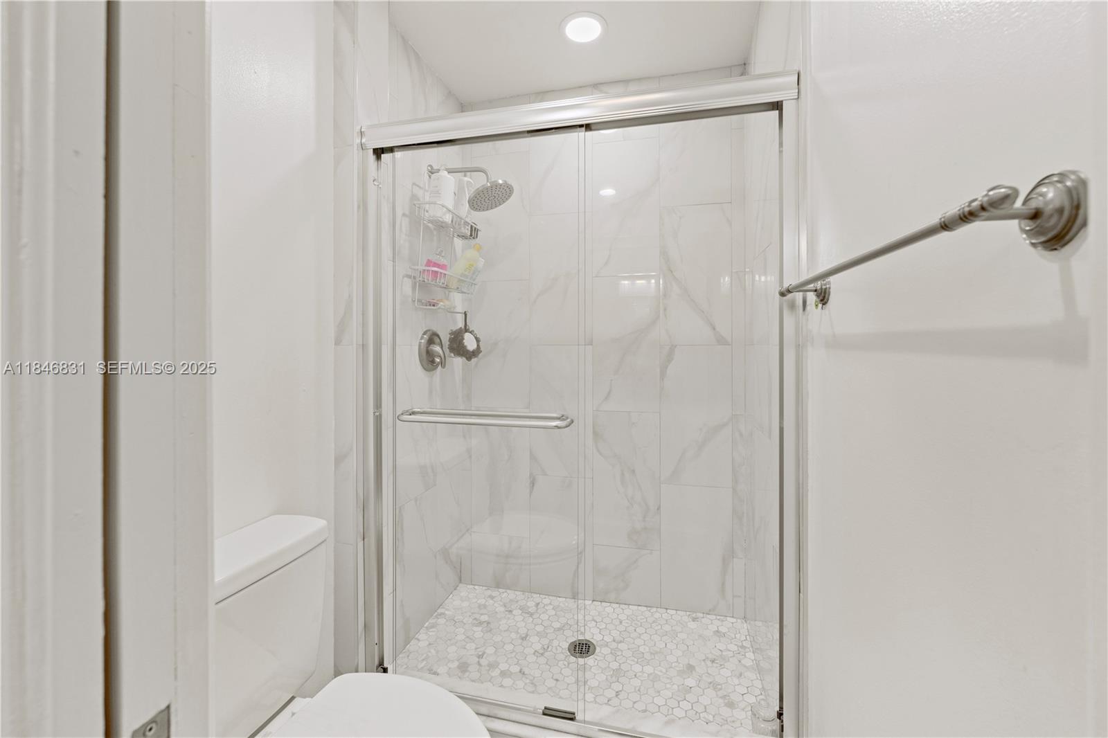 6603 Via Regina, Unit 50 Boca Raton, FL 33433 - Photo 28 of 48 a bathroom with a shower and a toilet