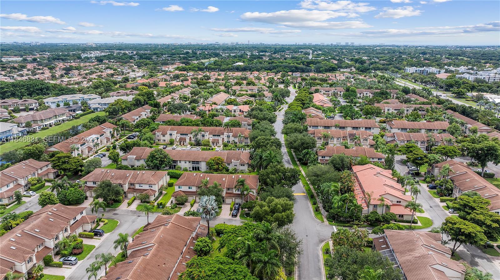 6603 Via Regina, Unit 50 Boca Raton, FL 33433 - Photo 35 of 48 an aerial view of residential houses with outdoor space