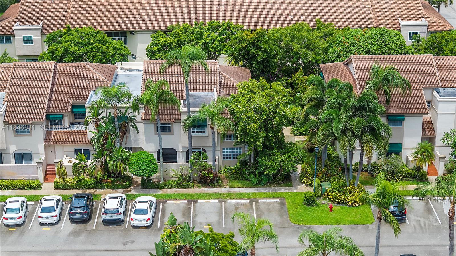 6603 Via Regina, Unit 50 Boca Raton, FL 33433 - Photo 37 of 48 front view of a house with a yard
