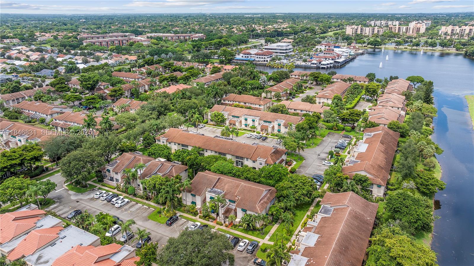 6603 Via Regina, Unit 50 Boca Raton, FL 33433 - Photo 38 of 48 an aerial view of lake and residential houses with outdoor space
