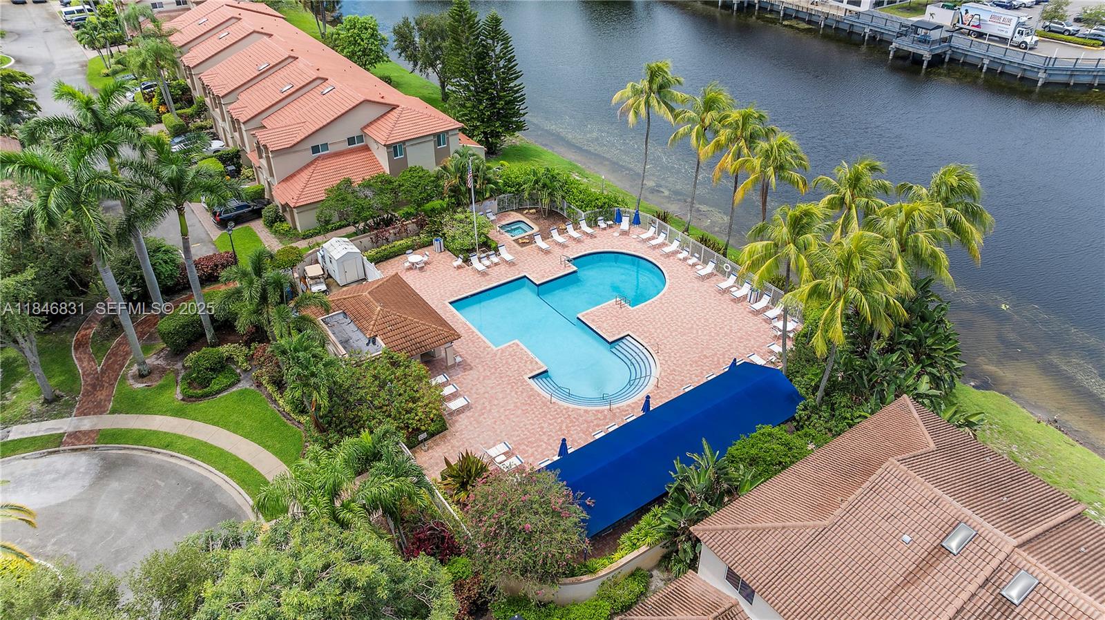 6603 Via Regina, Unit 50 Boca Raton, FL 33433 - Photo 40 of 48 an aerial view of a house with a garden and swimming pool