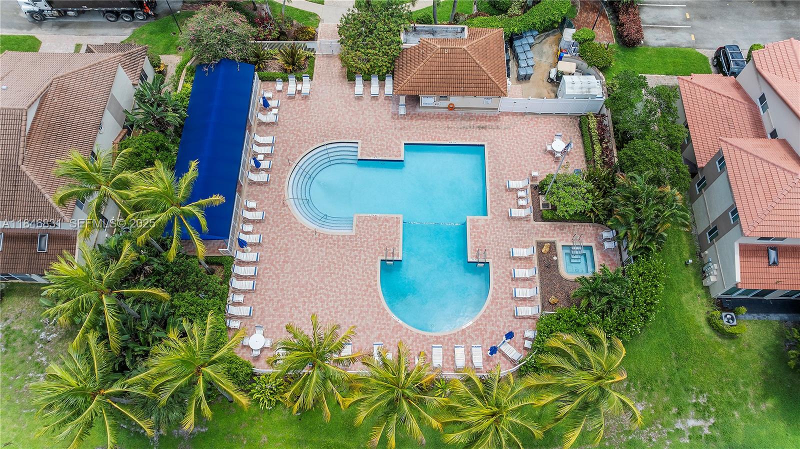 6603 Via Regina, Unit 50 Boca Raton, FL 33433 - Photo 41 of 48 an aerial view of a house with a swimming pool
