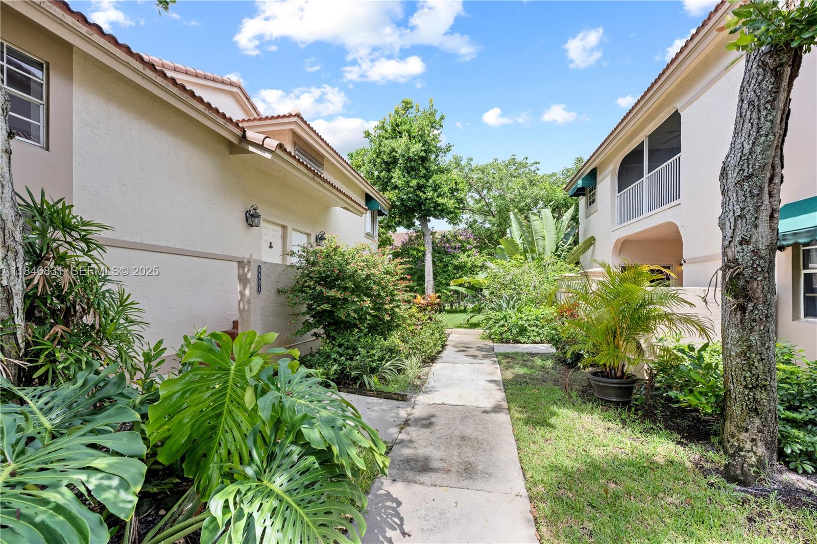 6603 Via Regina, Unit 50 Boca Raton, FL 33433 - Photo 46 of 48 a view of a backyard with potted plants