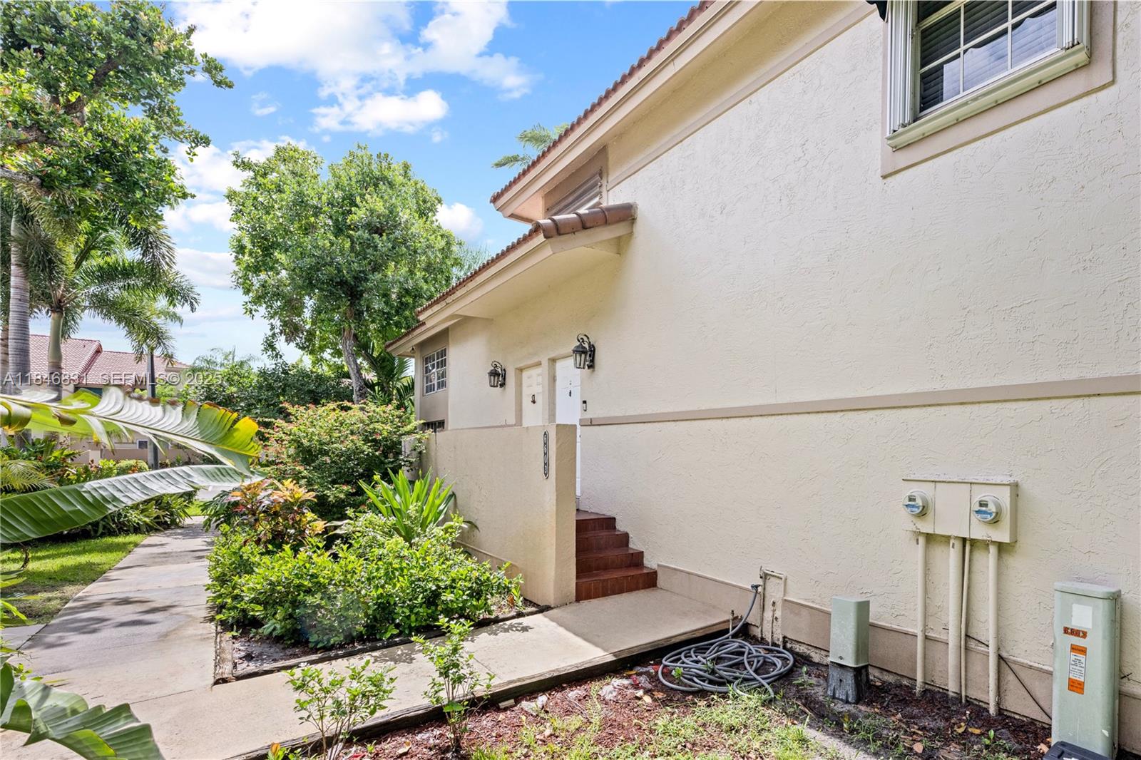 6603 Via Regina, Unit 50 Boca Raton, FL 33433 - Photo 5 of 48 a backyard of a house with lots of green space