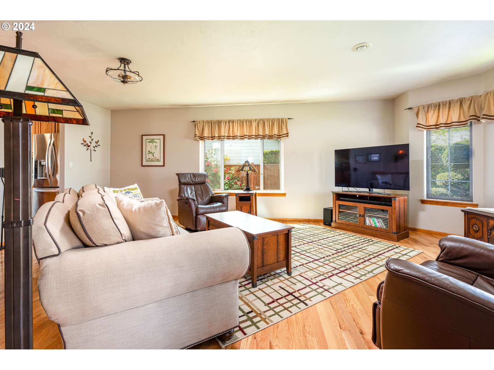 1769 Carriage Place Springfield, OR 97477 - Photo 12 of 23 a living room with furniture and a flat screen tv
