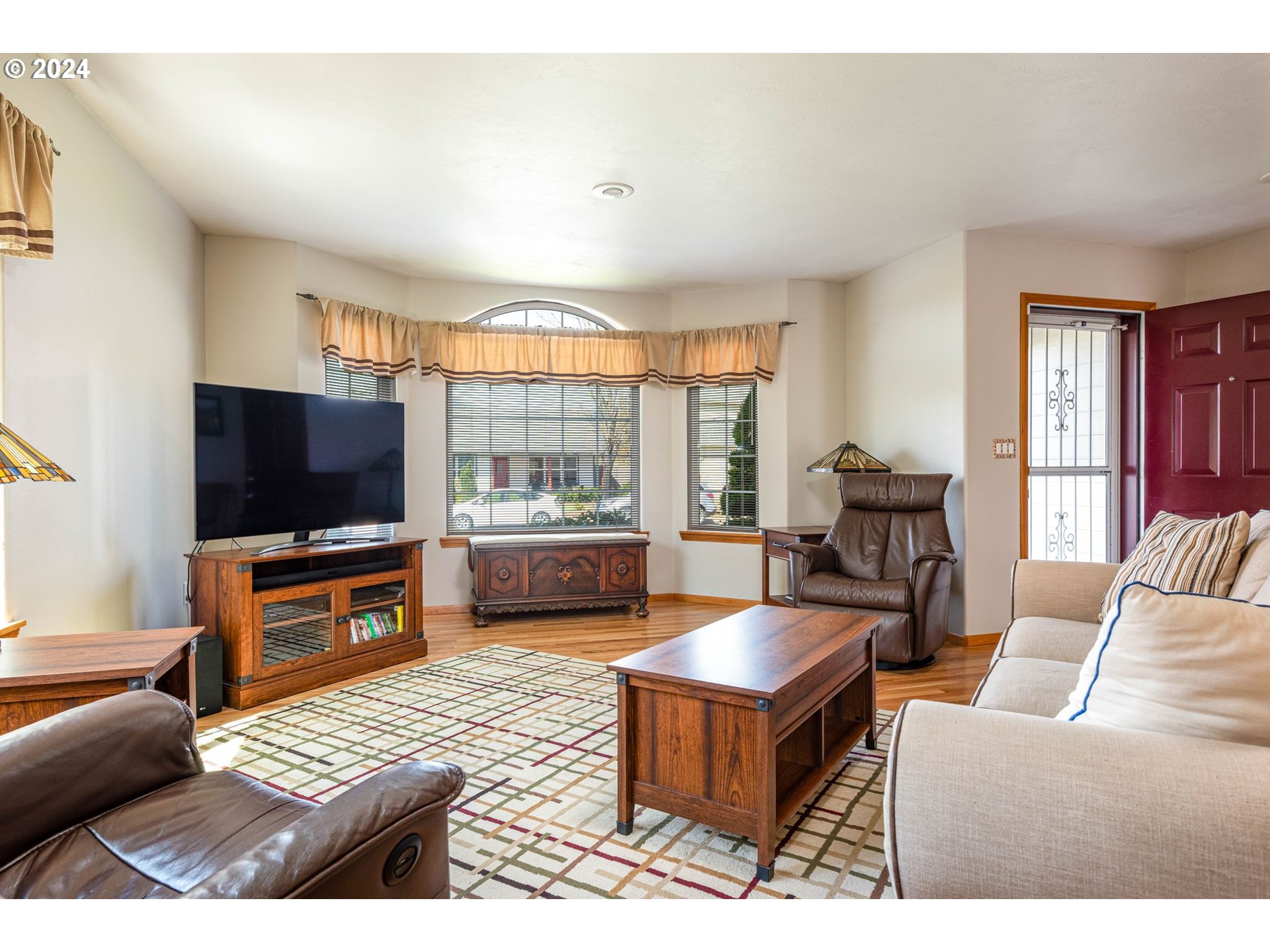 1769 Carriage Place Springfield, OR 97477 - Photo 13 of 23 a living room with furniture and a flat screen tv