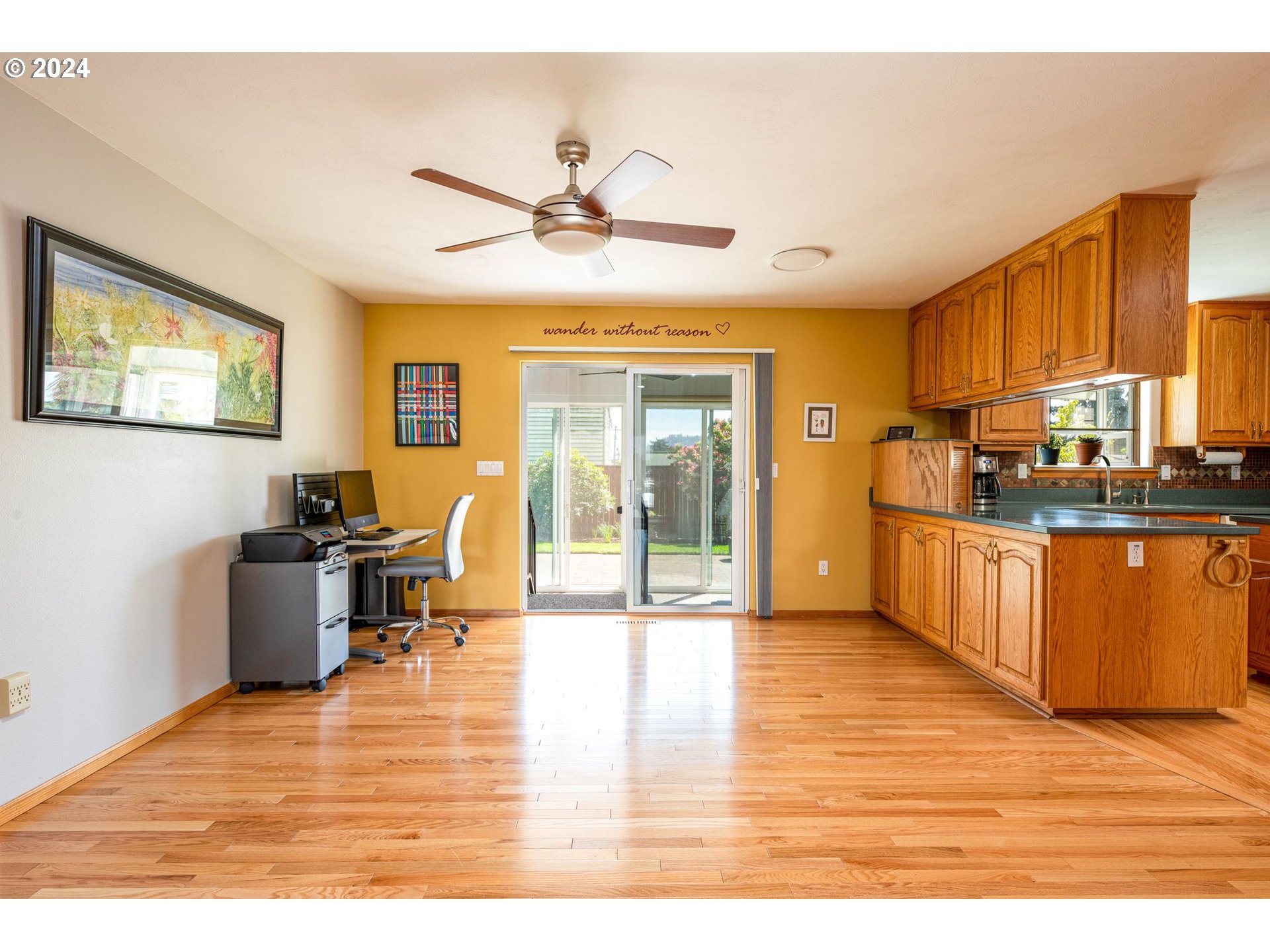 1769 Carriage Place Springfield, OR 97477 - Photo 14 of 23 a living room with stainless steel appliances kitchen island granite countertop a refrigerator a stove top oven a sink and dishwasher