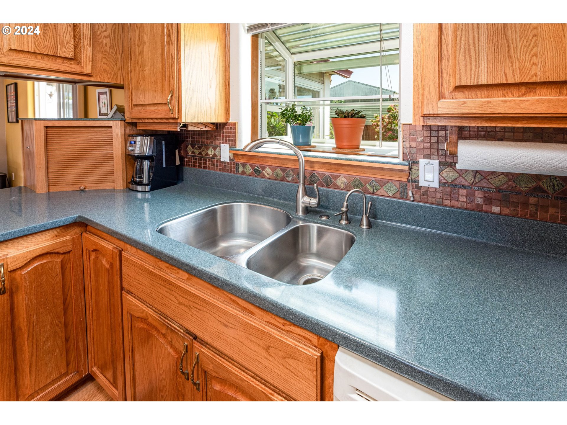 1769 Carriage Place Springfield, OR 97477 - Photo 18 of 23 a kitchen with stainless steel appliances granite countertop a sink and a window