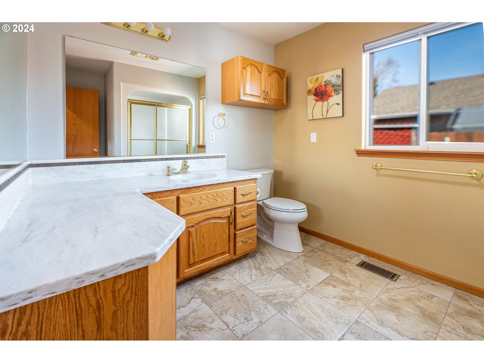 1769 Carriage Place Springfield, OR 97477 - Photo 20 of 23 a bathroom with a sink a toilet and mirror