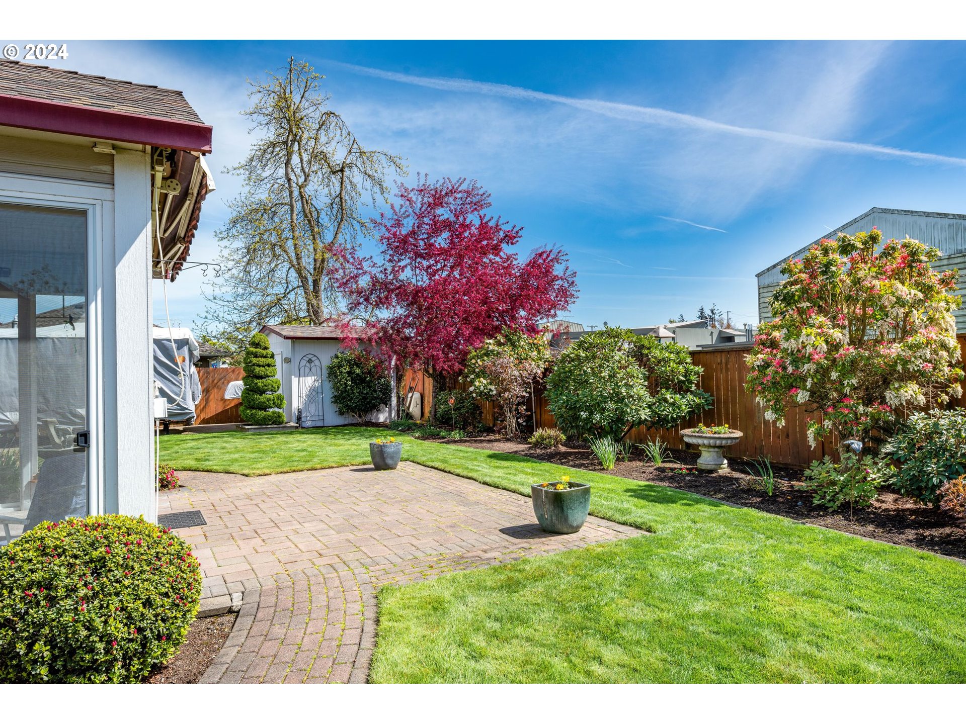1769 Carriage Place Springfield, OR 97477 - Photo 5 of 23 a house with a yard and a large tree