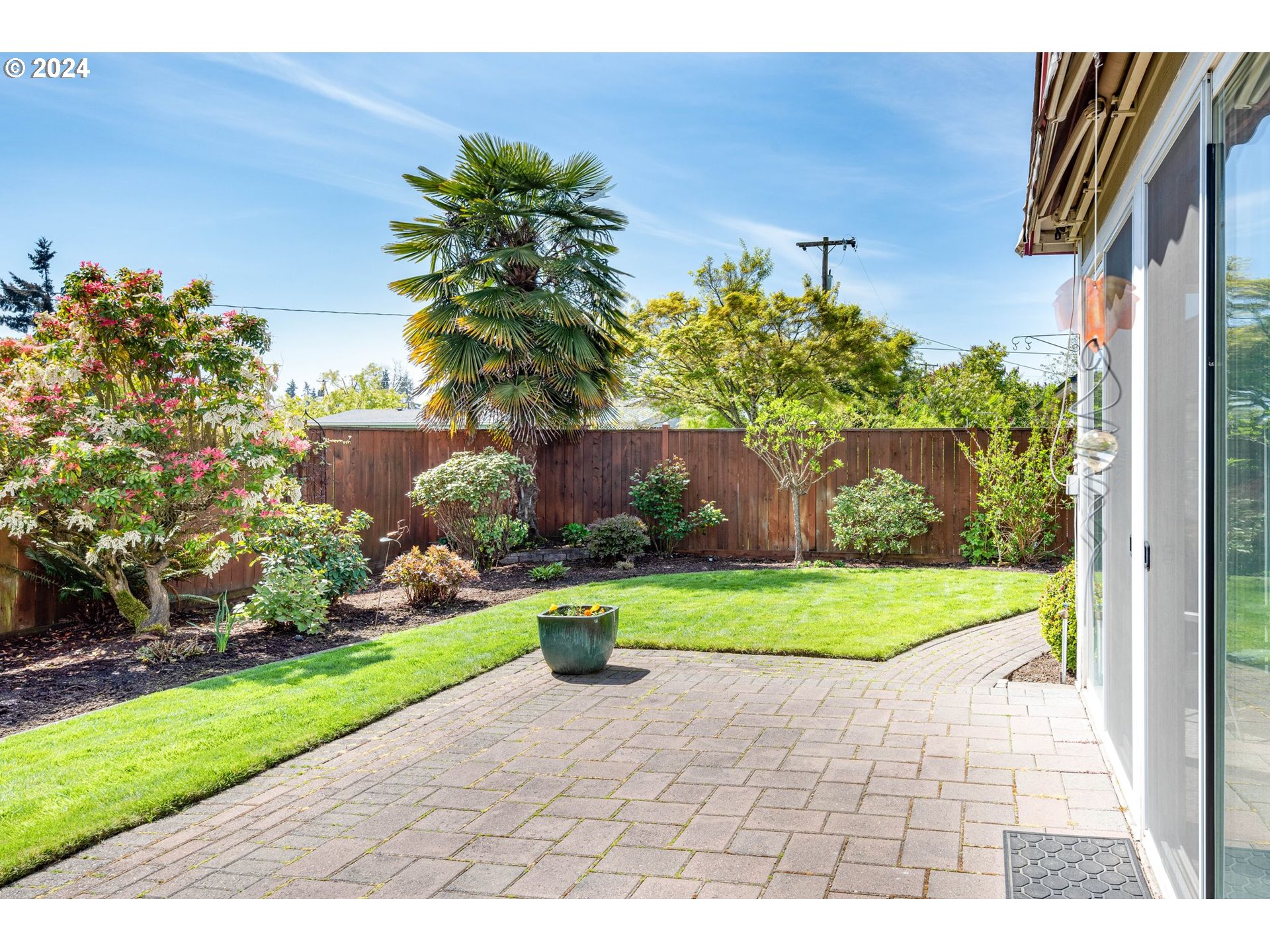 1769 Carriage Place Springfield, OR 97477 - Photo 6 of 23 a front view of a house with a yard and fountain in middle