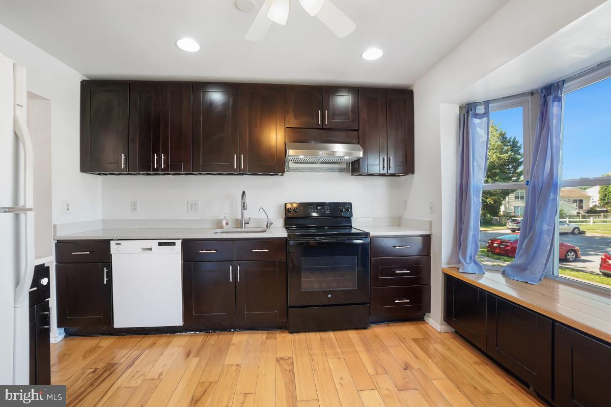 35 Bellfalls Way Nottingham, MD 21236 - Photo 5 of 30 a kitchen with stainless steel appliances granite countertop a stove a sink and a microwave