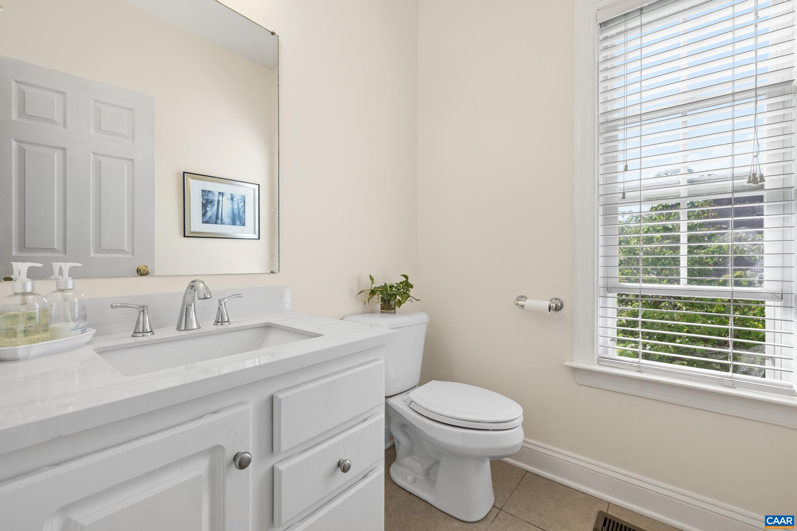 1236 Amber Ridge Road Charlottesville, VA 22901 - Photo 20 of 56 a bathroom with a toilet a sink and a window