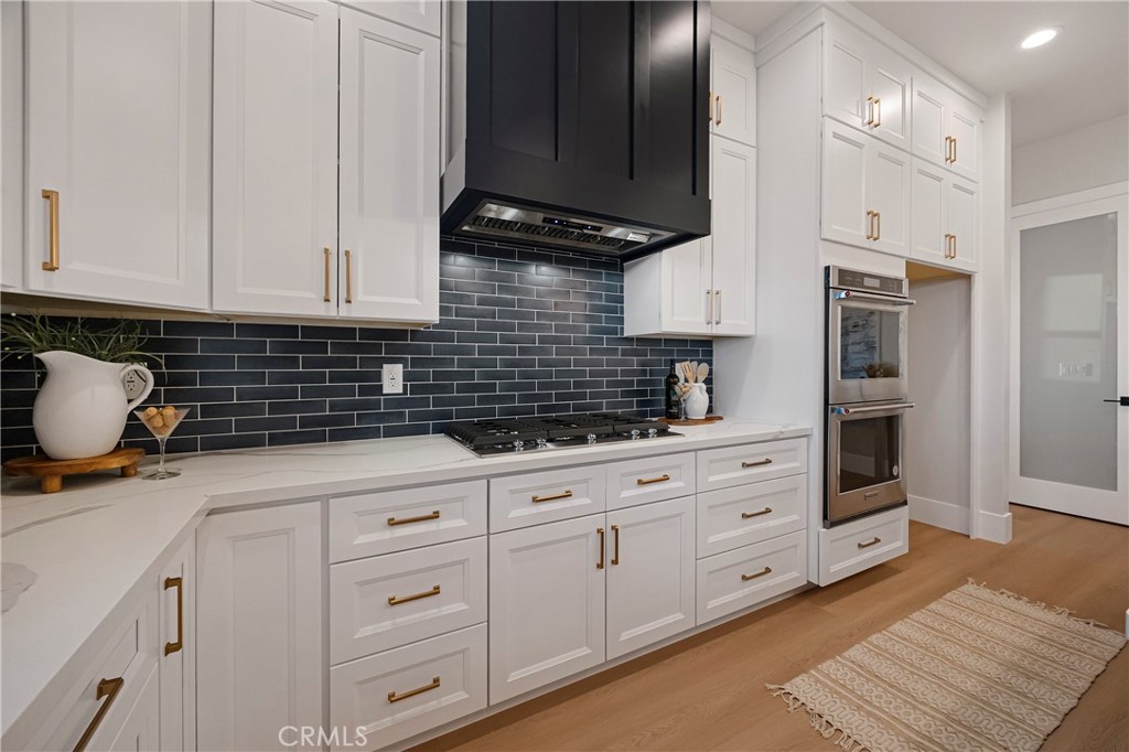 500 Sunset Drive Paradise, CA 95969 - Photo 16 of 43 a kitchen with granite countertop white cabinets and stainless steel appliances