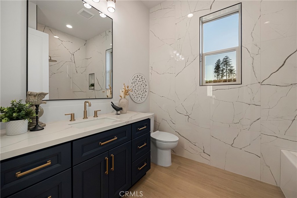 500 Sunset Drive Paradise, CA 95969 - Photo 29 of 43 a bathroom with a granite countertop toilet a sink and mirror