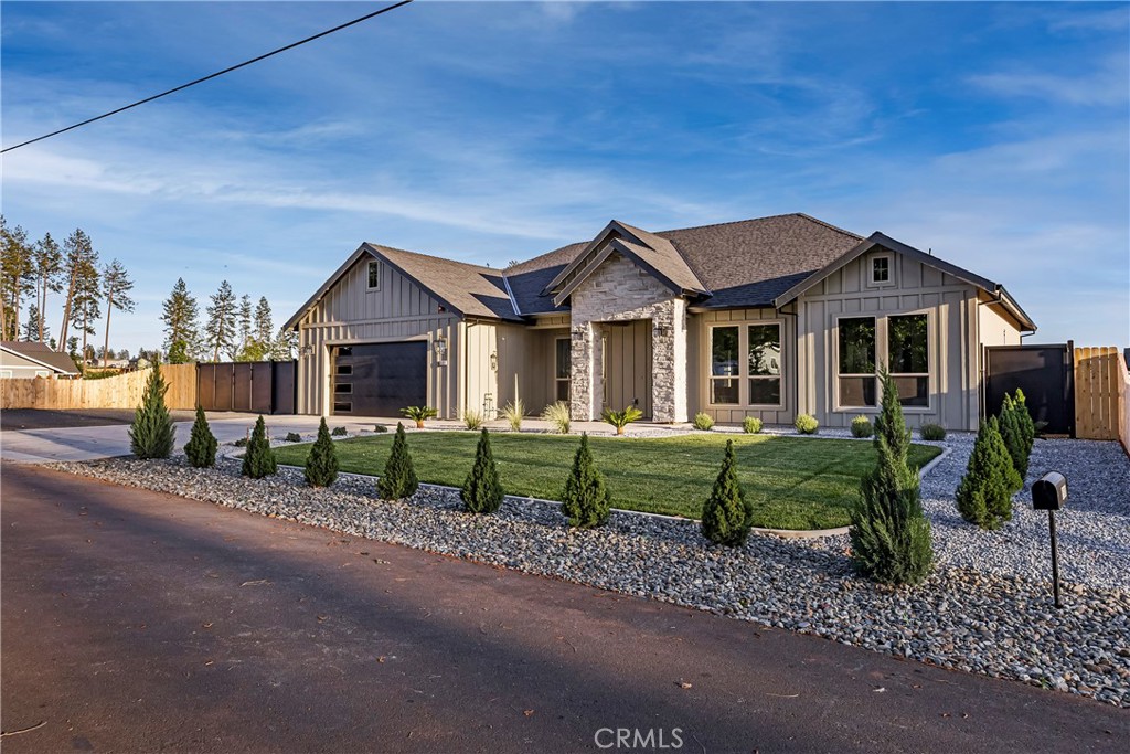 500 Sunset Drive Paradise, CA 95969 - Photo 3 of 43 a front view of a house with a garden and trees