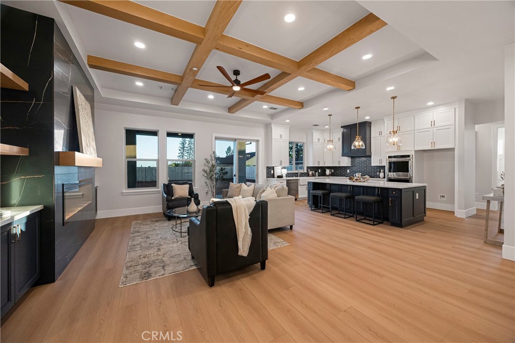 500 Sunset Drive Paradise, CA 95969 - Photo 10 of 43 a large kitchen with stainless steel appliances granite countertop a stove a sink dishwasher a microwave oven with cabinets and wooden floor