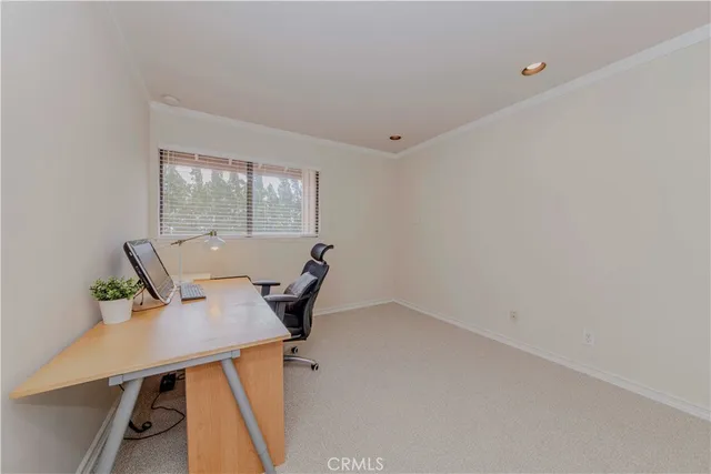 a view of a patio with table and chairs and potted plants