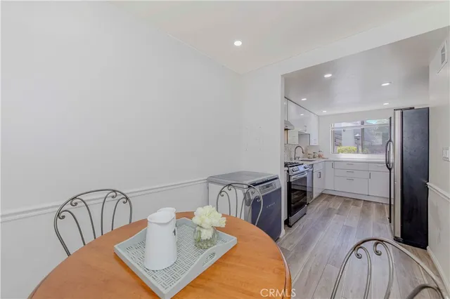 a view of a room with a table and chairs