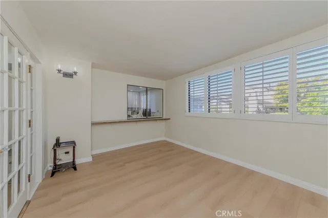 a view of a dining room with furniture and a chandelier
