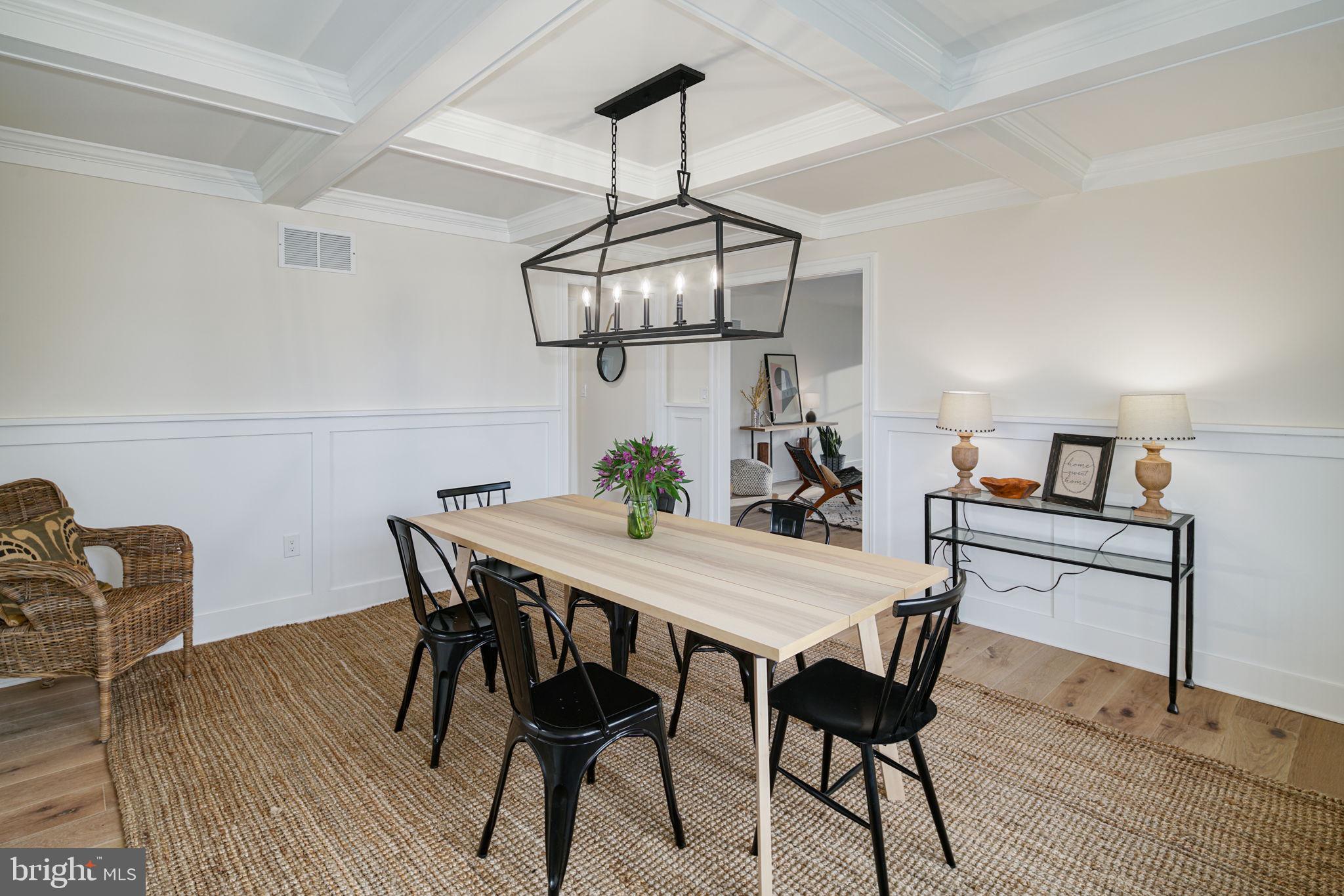 745 Cedar Avenue Haddonfield, NJ 08033 - Photo 13 of 55 a view of a dining room with furniture a chandelier and wooden floor