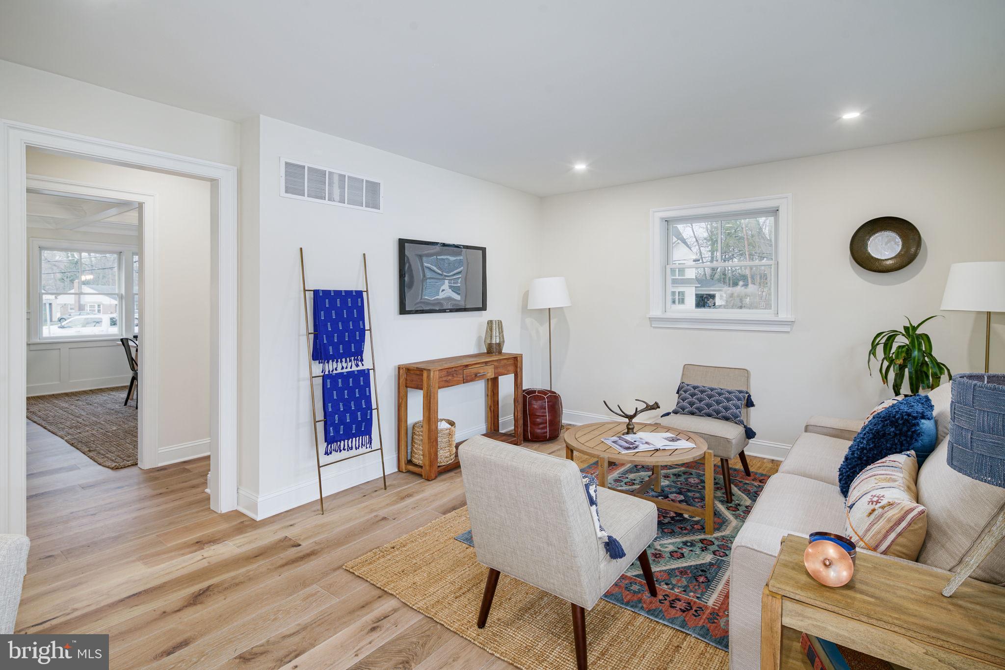 745 Cedar Avenue Haddonfield, NJ 08033 - Photo 16 of 55 a living room with fireplace furniture and wooden floor