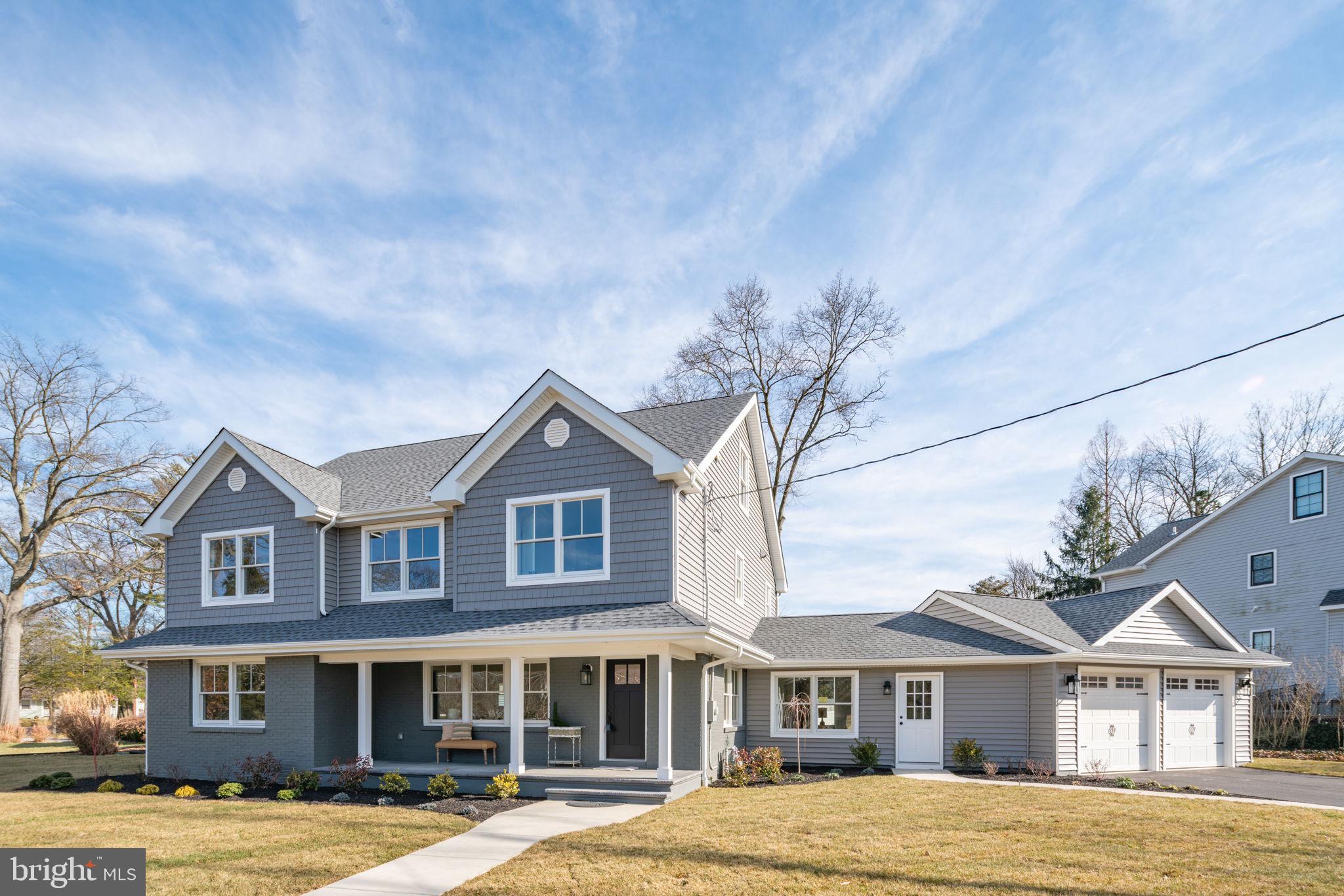 745 Cedar Avenue Haddonfield, NJ 08033 - Photo 2 of 55 a front view of a house with garden