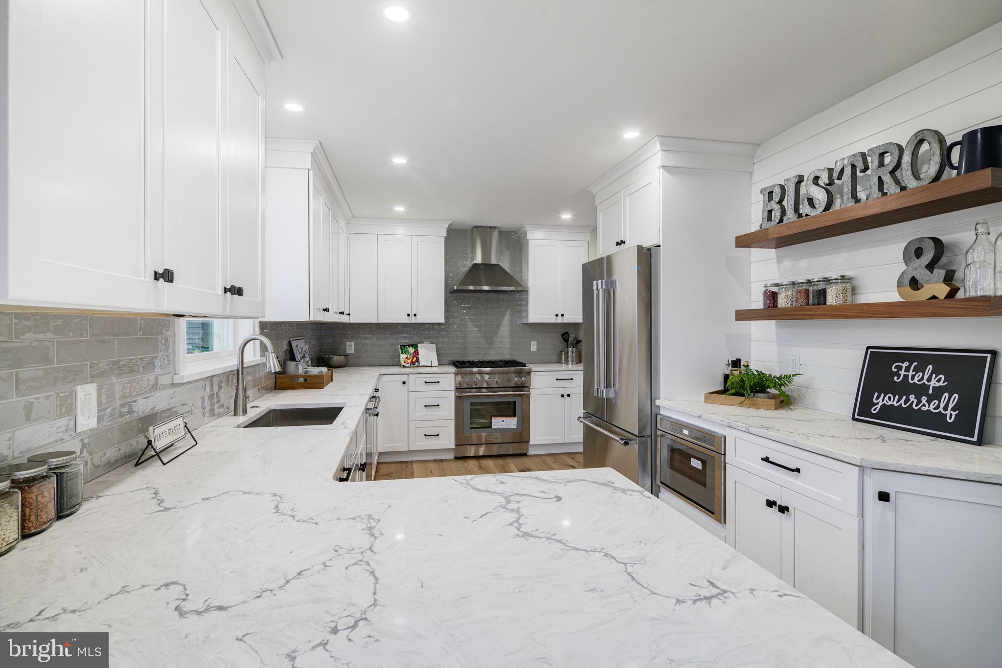 745 Cedar Avenue Haddonfield, NJ 08033 - Photo 22 of 55 a kitchen with refrigerator and cabinets