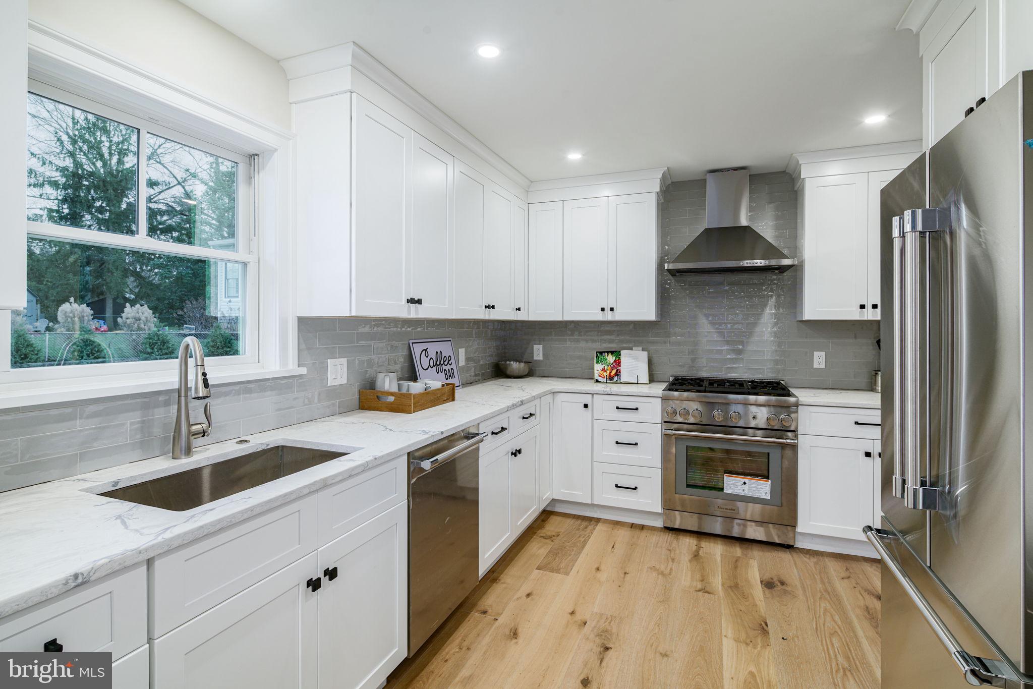 745 Cedar Avenue Haddonfield, NJ 08033 - Photo 25 of 55 a kitchen with stainless steel appliances granite countertop a sink stove and refrigerator